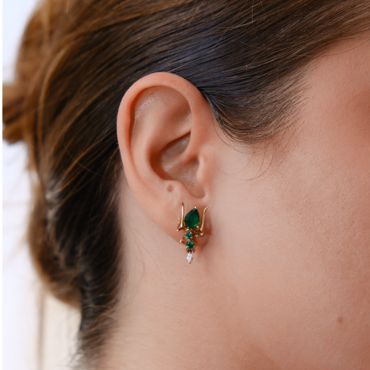 Kokoro_Stud_Earring_in_14K_Yellow_Gold_with_0.76_ct_Emerald_and_0.035_ct_Diamond_on_model_Cocoerow_Fine_Jewelry