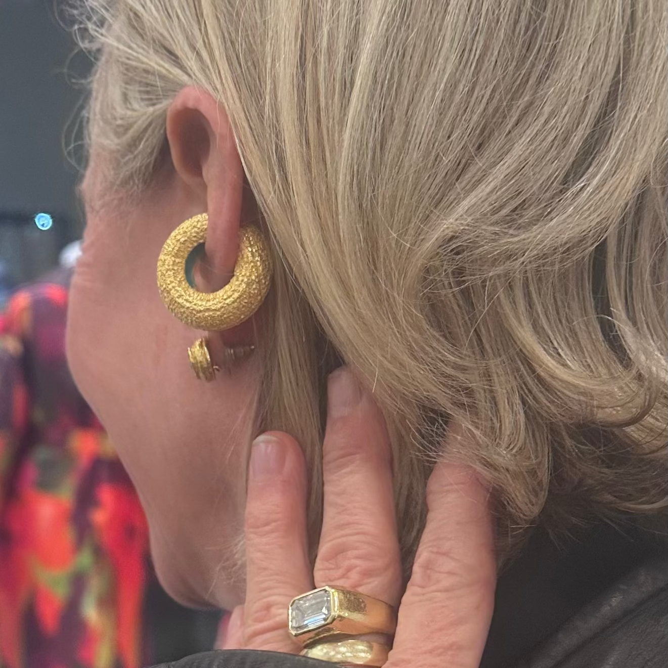 Client of Cocoerow Fine jewelry in textured gold ear cuff