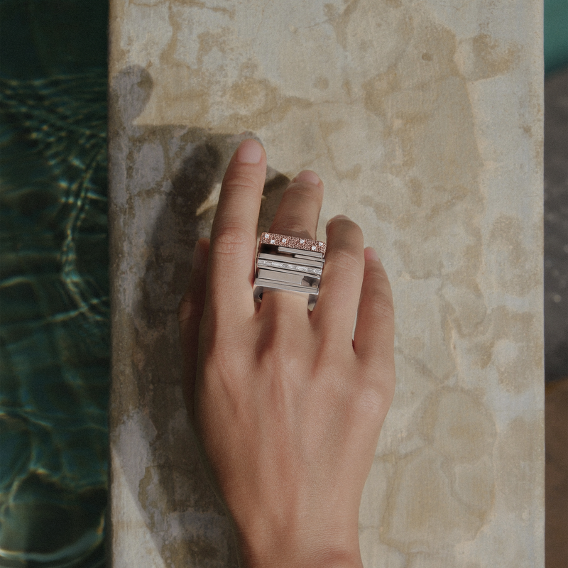 Nomi ring by cocoerow fine jewelry in silver with white diamonds on models hand