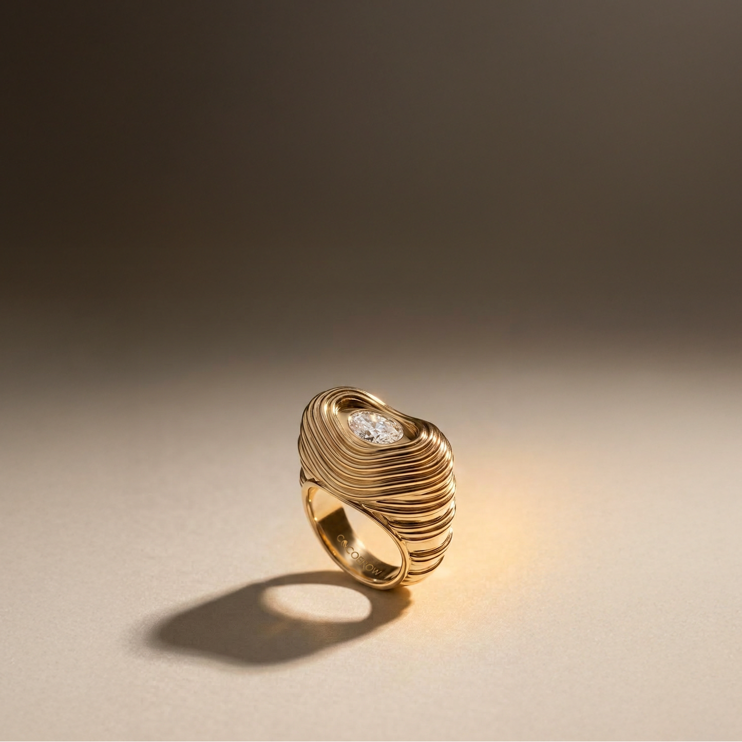 14k Yellow Gold ring with a diamond on a gradient background Cocoerow Fine Jewelry