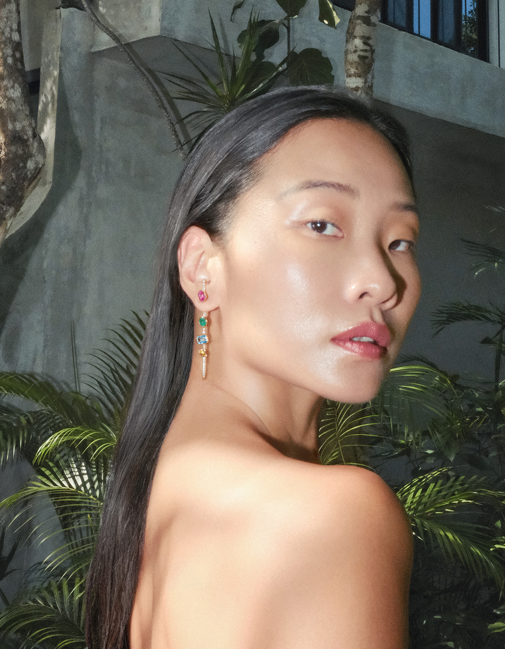 cocoerow fine jewelry vira pin earring on model in tulum 14k yellow gold jewelry