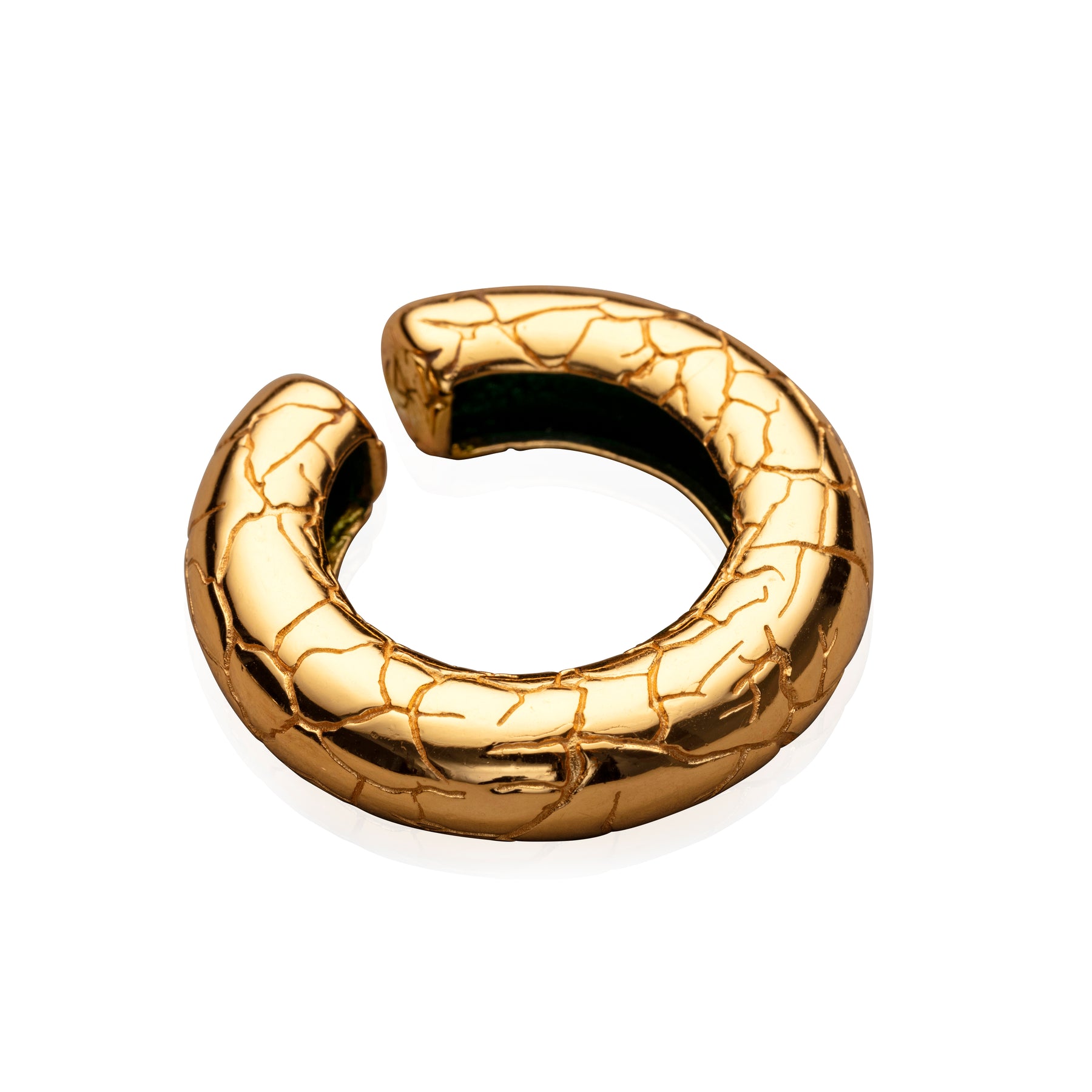 large gold ear cuff with white background